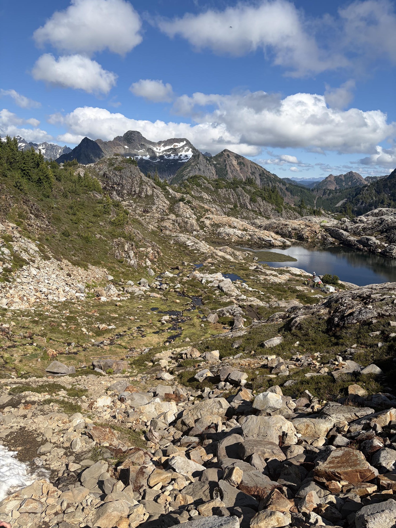 Wide view of Gothic Basin's alpine tarn, campsites, and surrounding peaks